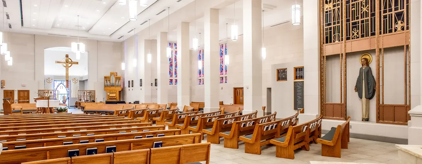 An interior view of the pews of the Christ the King Chapel.